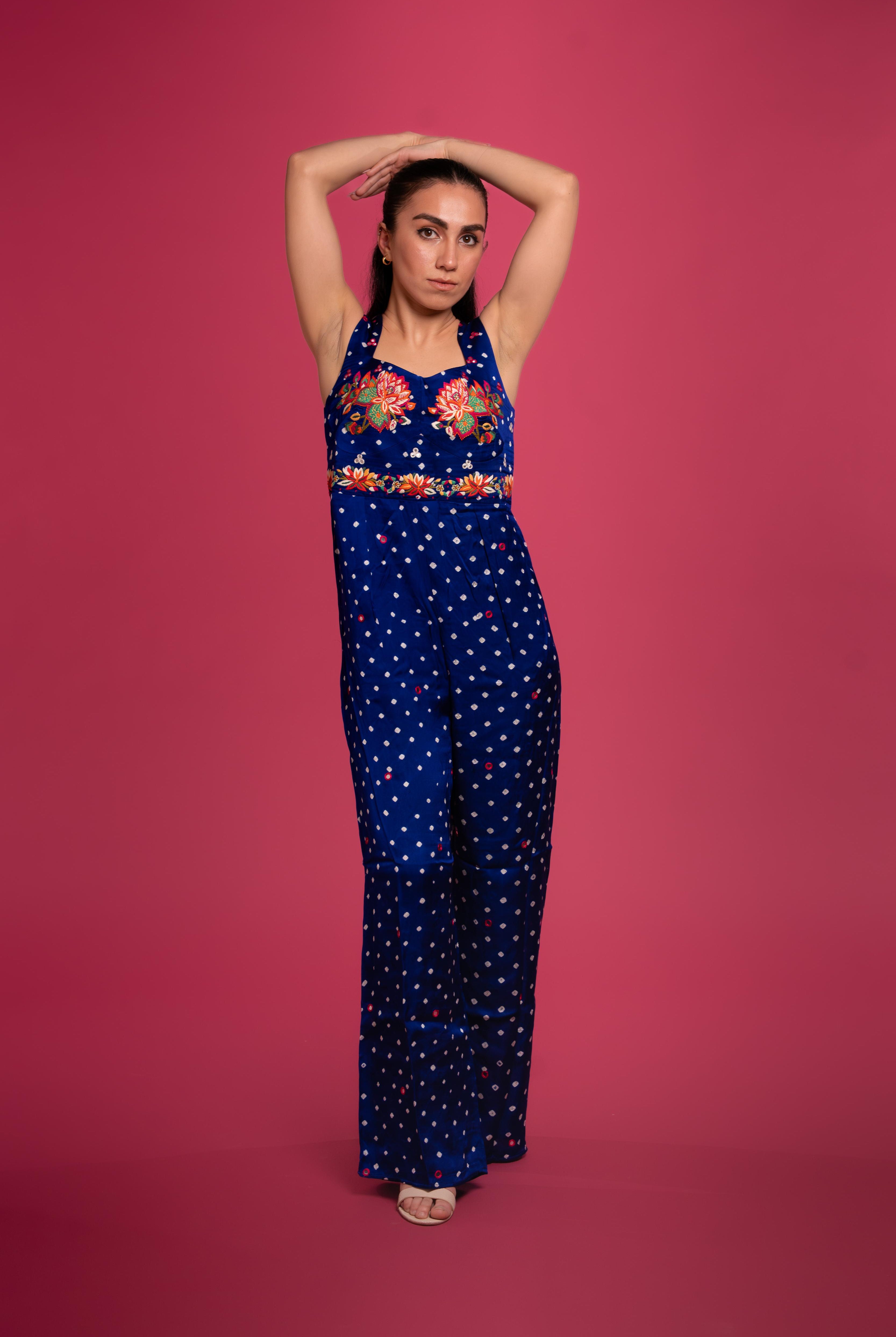 Bandhani tie-dye jumpsuit with lotus hand embroidery, and flowing wide-leg pants—blending tradition with modern elegance.