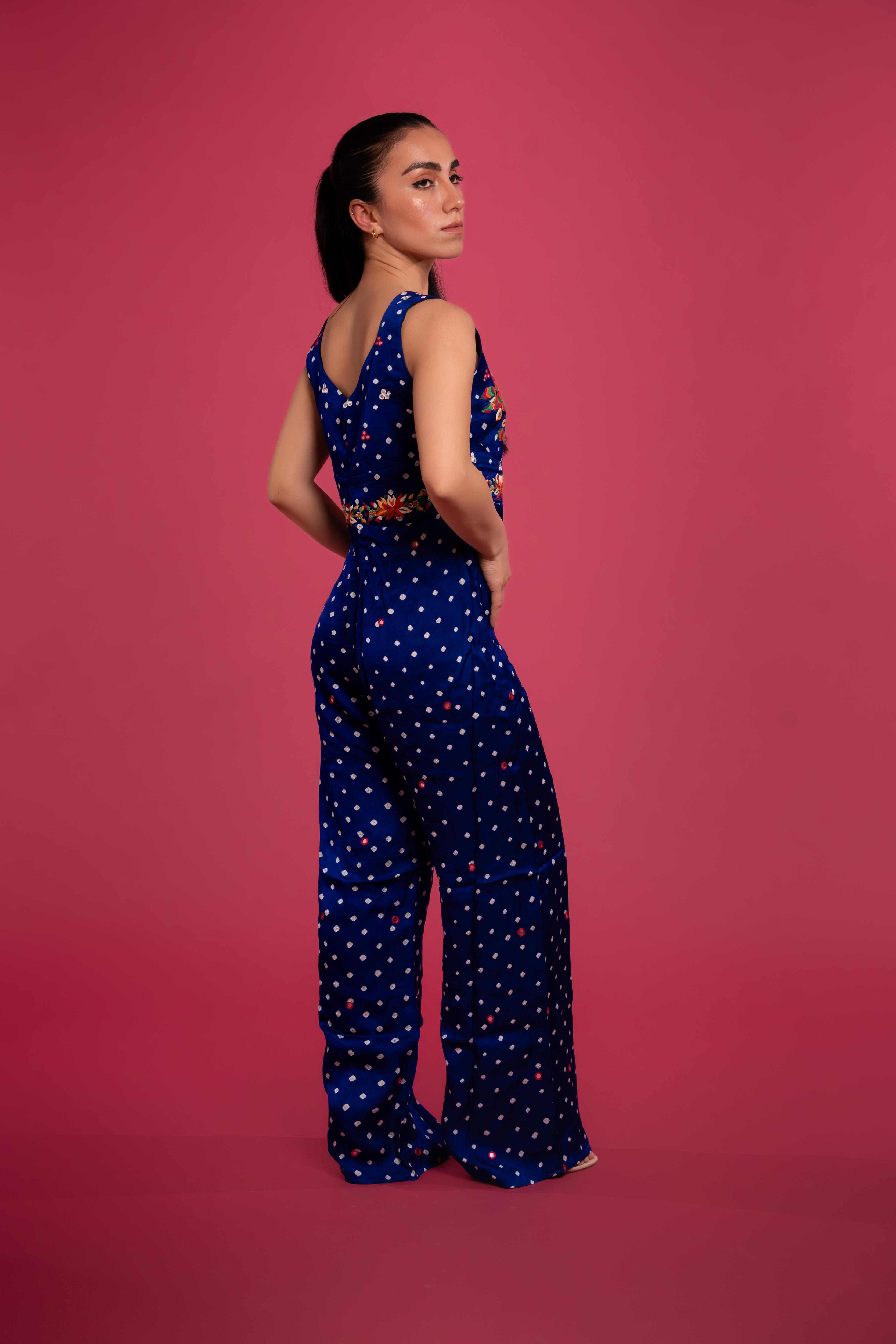 Bandhani tie-dye jumpsuit with lotus hand embroidery, and flowing wide-leg pants—blending tradition with modern elegance.