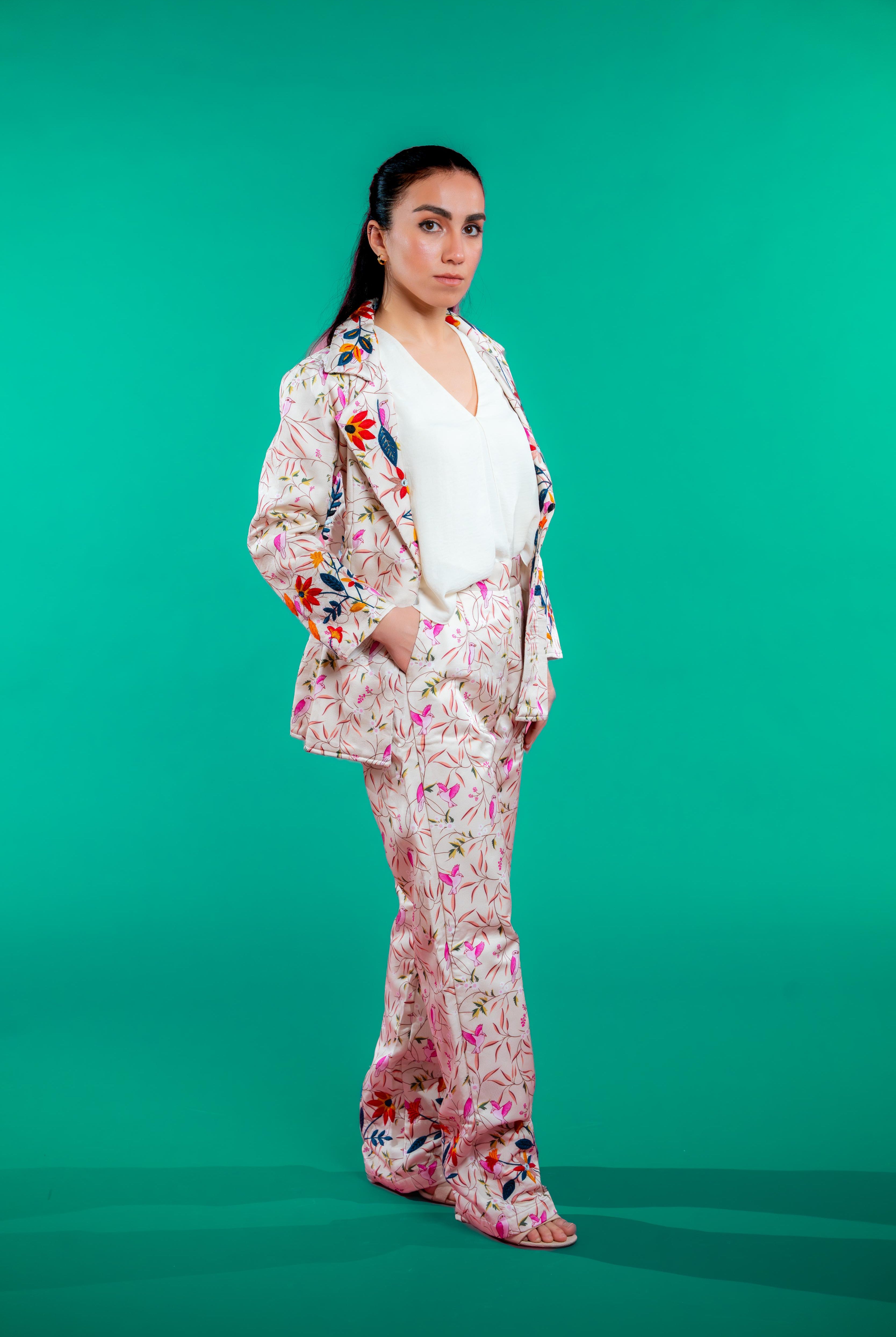 Artisan-crafted blazer and pants set featuring digital printed bird and foliage motifs with vibrant hand embroidery—designed for a cohesive, elegant, and sustainable look.