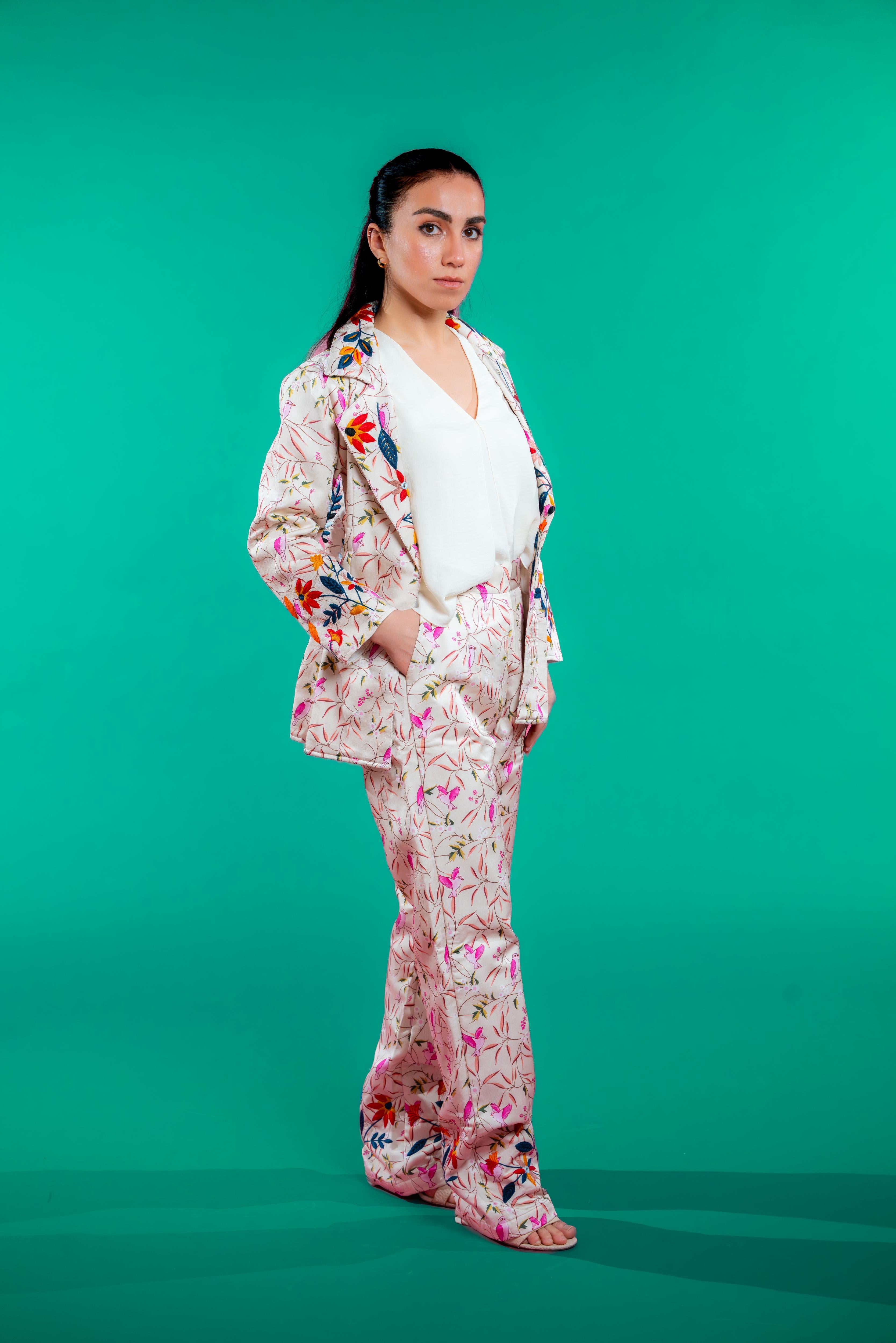 Artisan-crafted blazer and pants set featuring digital printed bird and foliage motifs with vibrant hand embroidery—designed for a cohesive, elegant, and sustainable look.