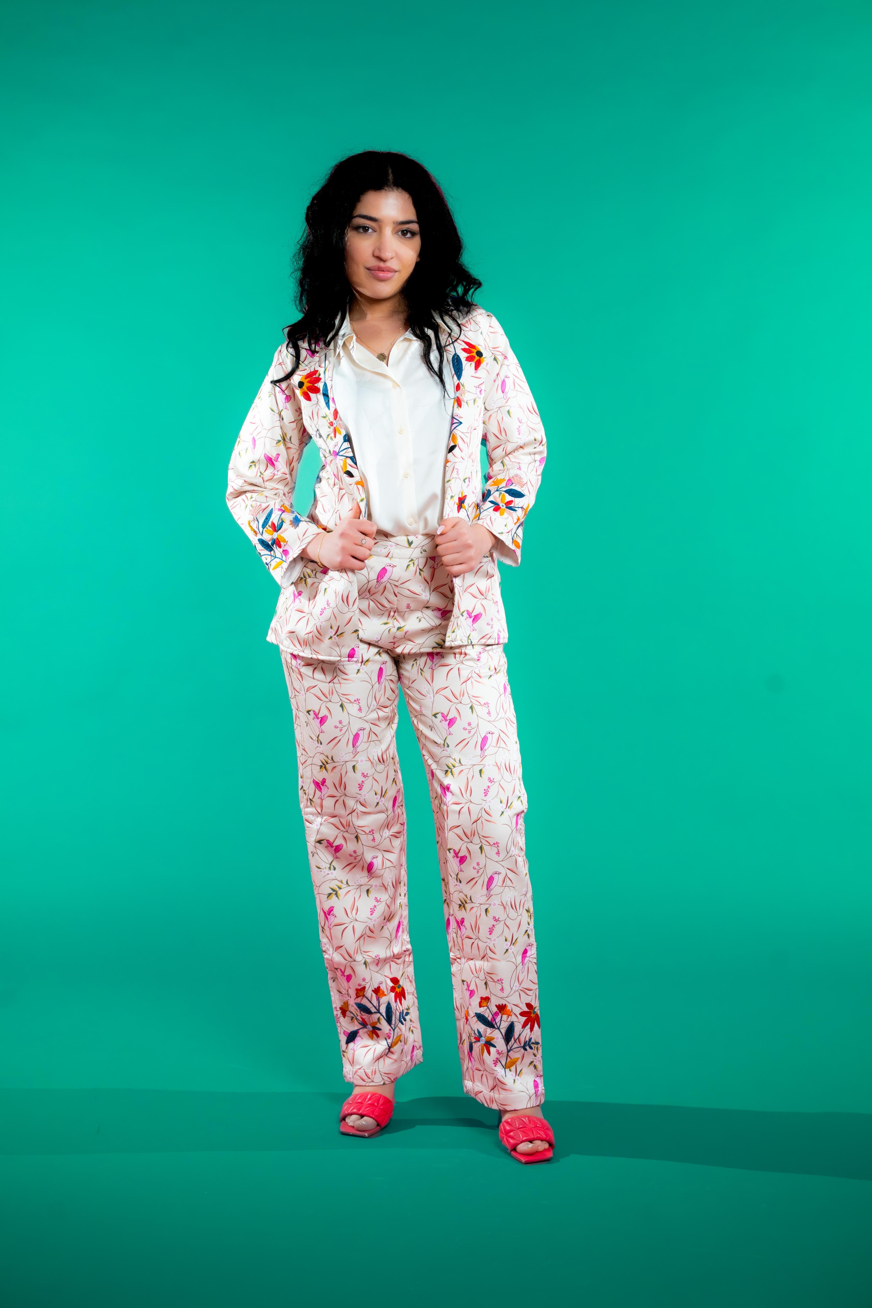 Artisan-crafted blazer and pants set featuring hand block-printed bird and foliage motifs with vibrant hand embroidery—designed for a cohesive, elegant, and sustainable look.