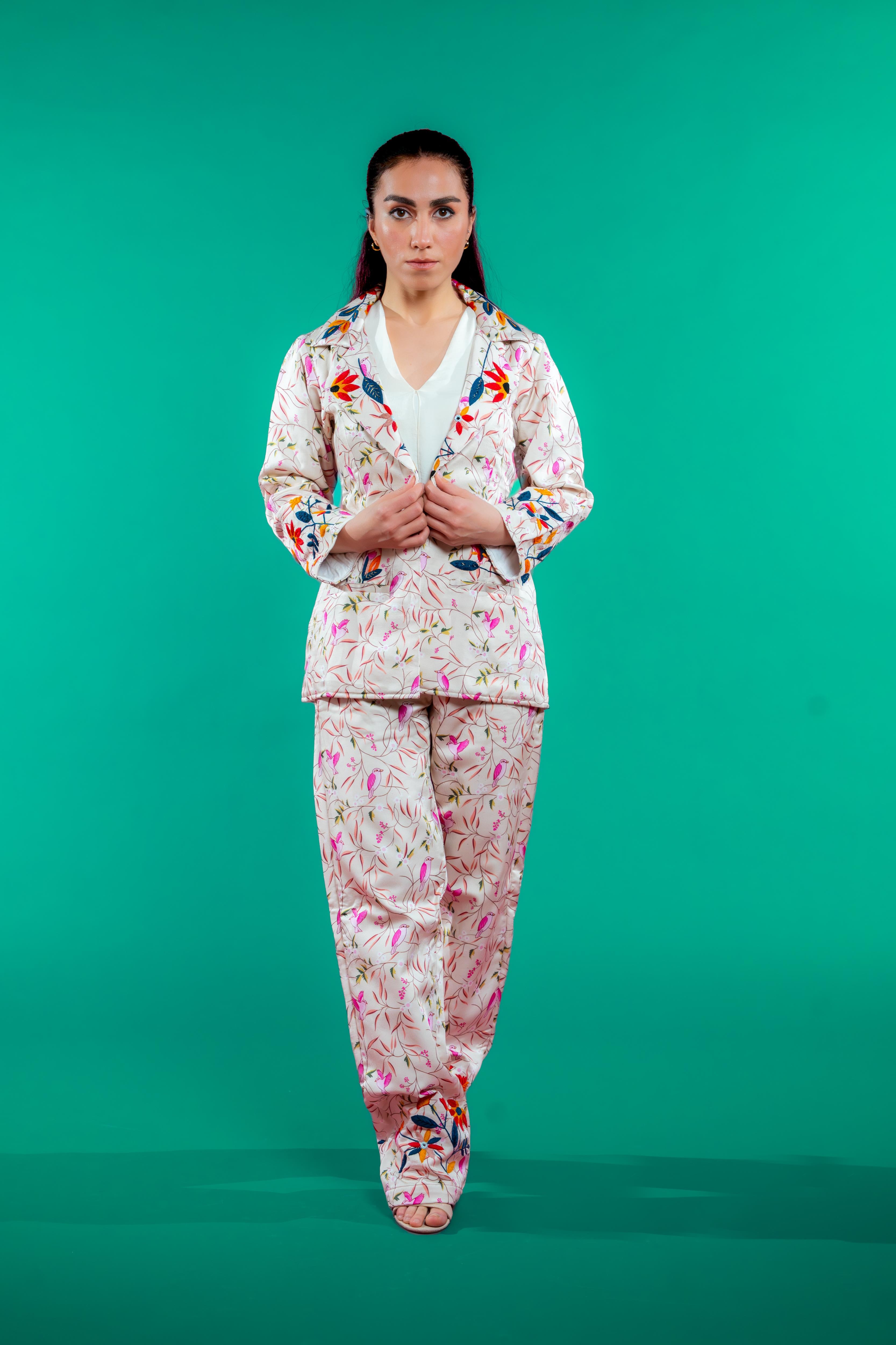 Artisan-crafted blazer and pants set featuring hand block-printed bird and foliage motifs with vibrant hand embroidery—designed for a cohesive, elegant, and sustainable look.