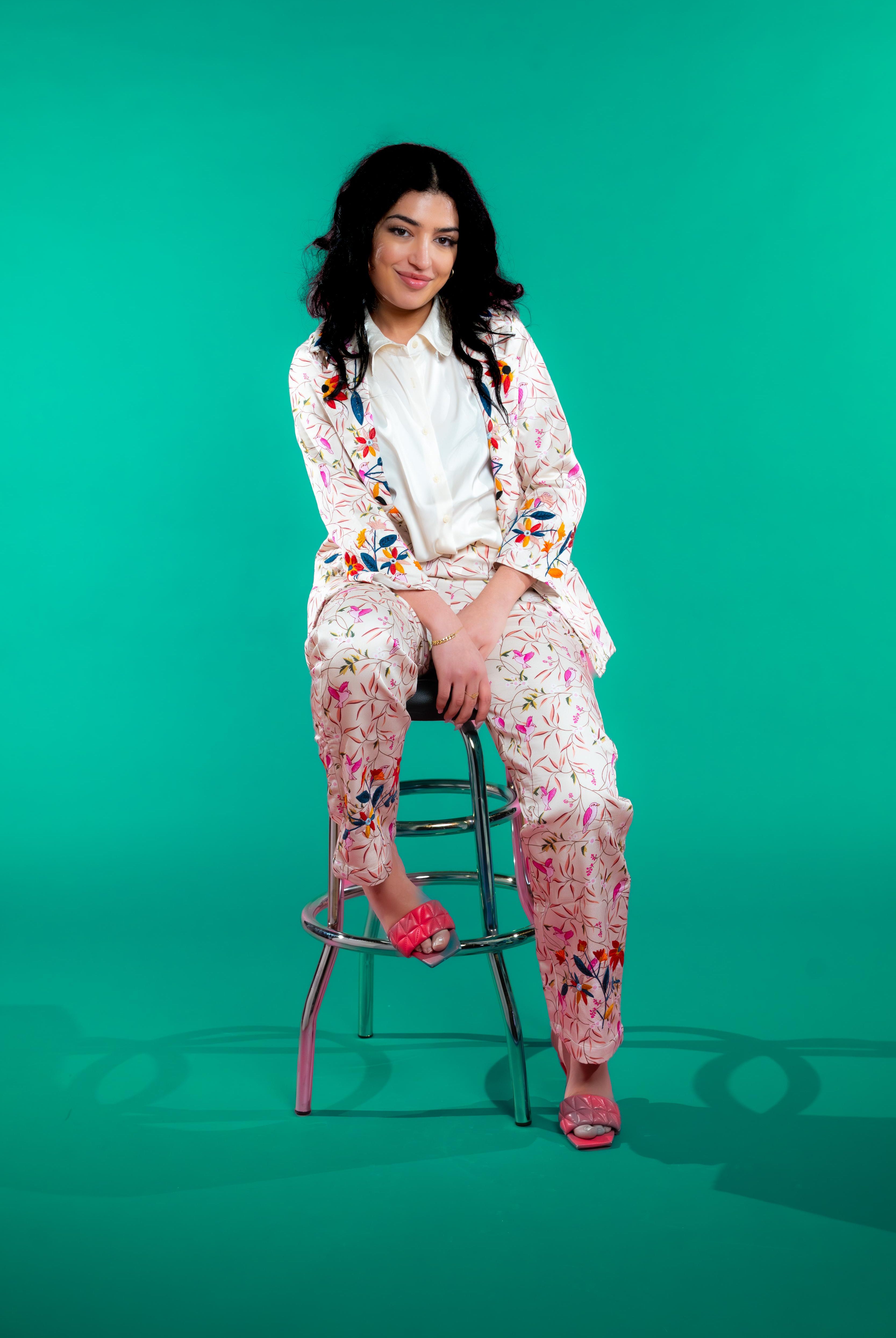 Artisan-crafted blazer and pants set featuring hand block-printed bird and foliage motifs with vibrant hand embroidery—designed for a cohesive, elegant, and sustainable look.