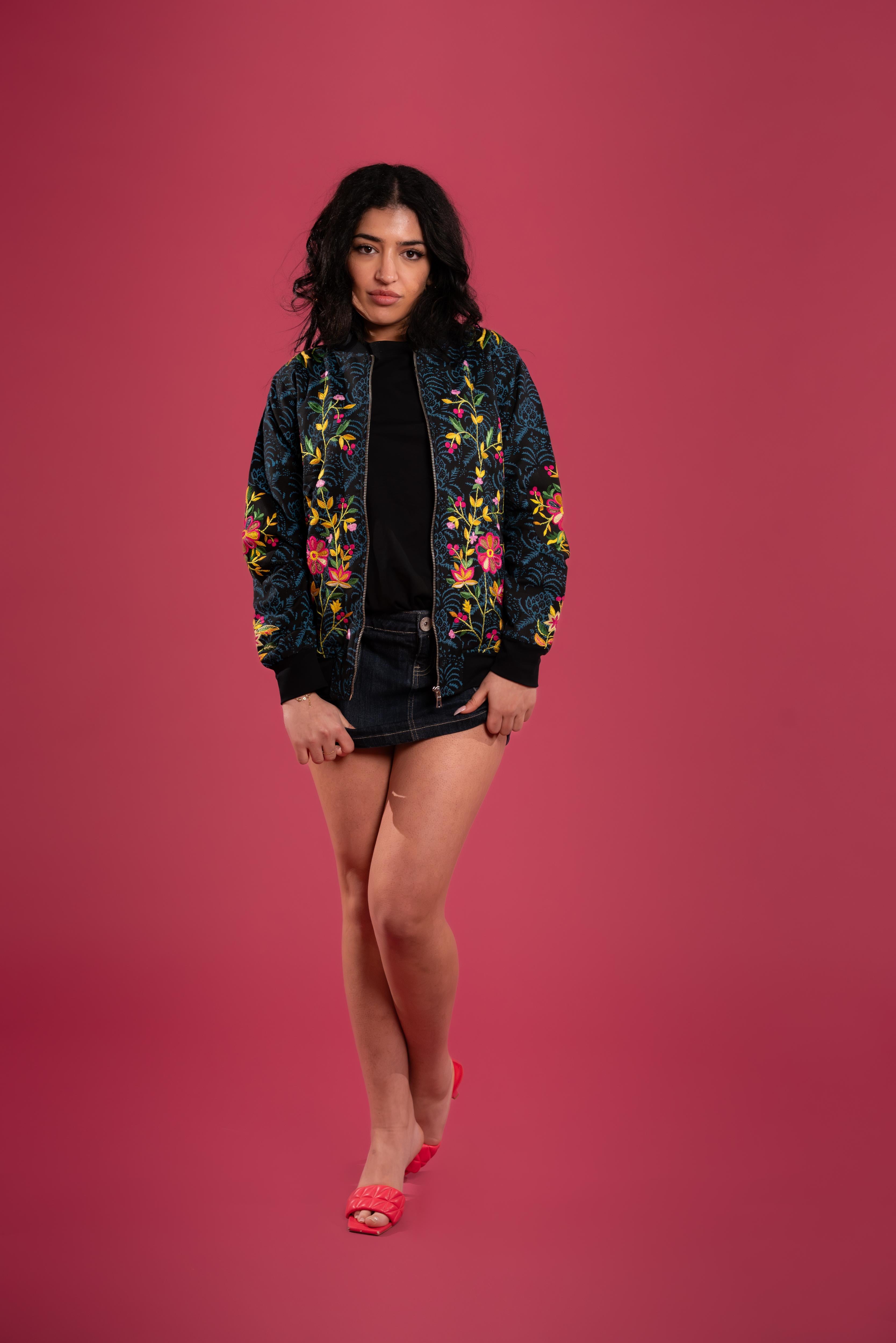 Hand block-printed bomber jacket with dyes, with floral embroidery and a bold hand-embroidered tiger on the back.