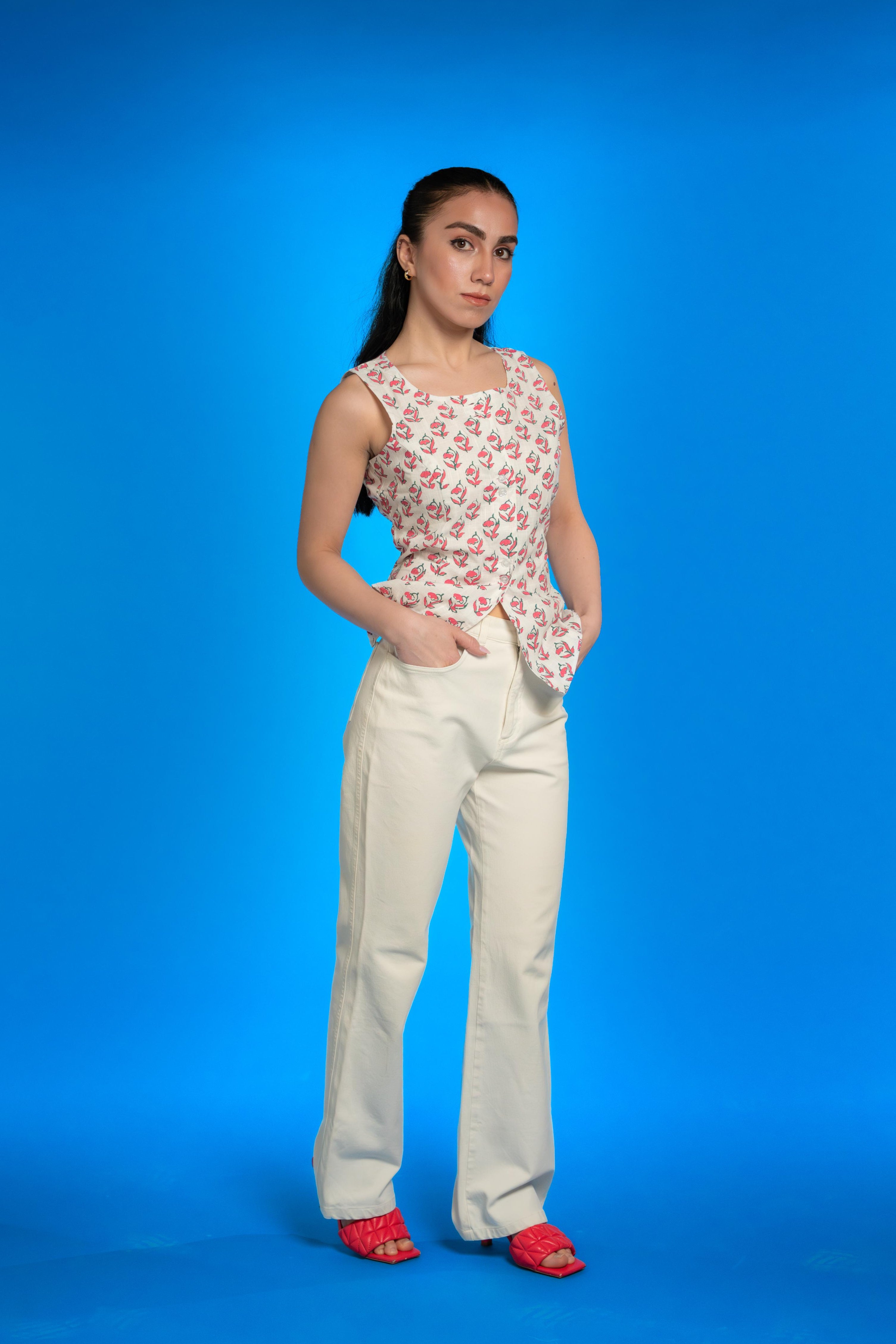 Handwoven cotton waistcoat with floral block-print motifs, tailored fit, and artisanal detailing—styled for modern, sustainable fashion.