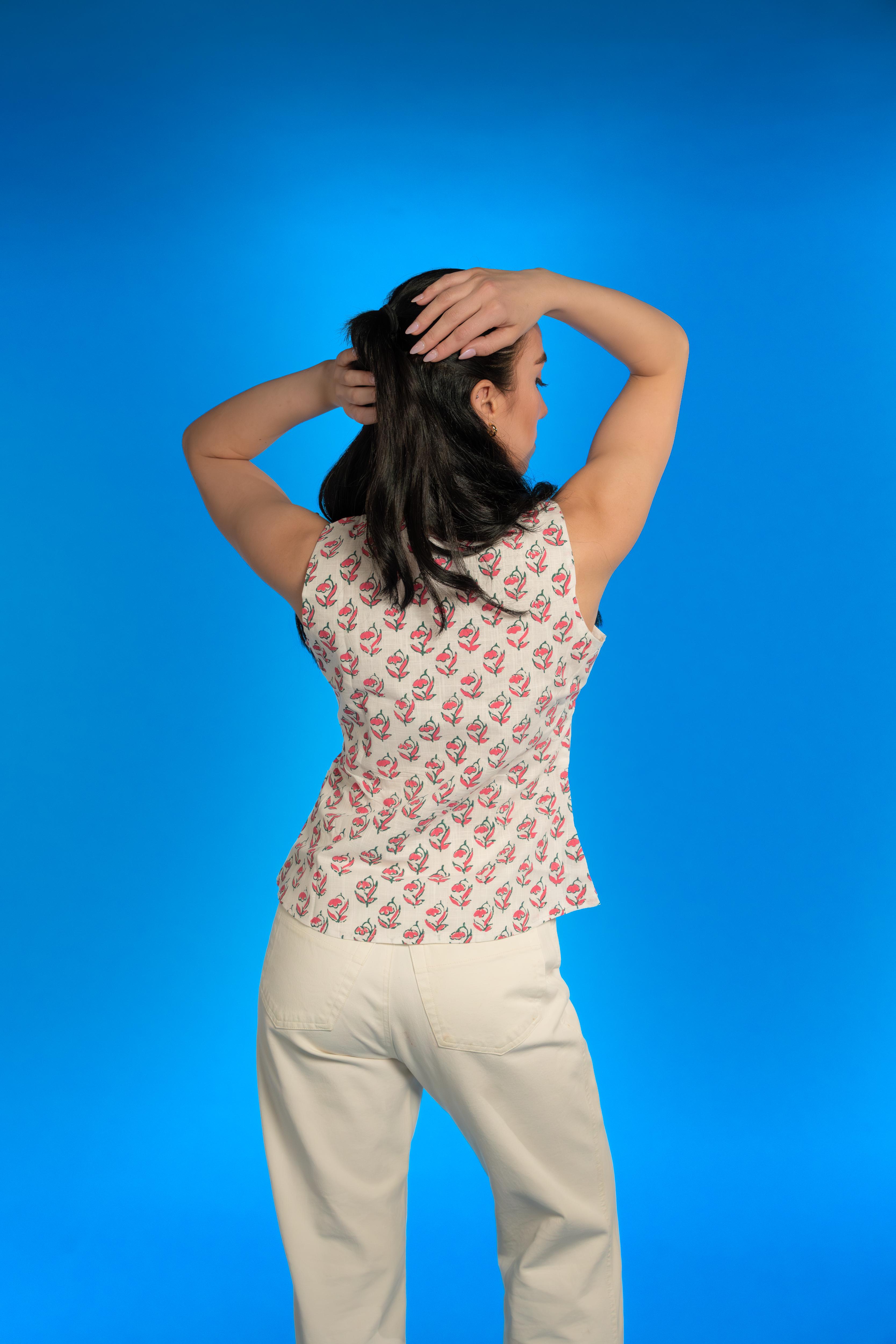 Handwoven cotton waistcoat with floral block-print motifs, tailored fit, and artisanal detailing—styled for modern, sustainable fashion.